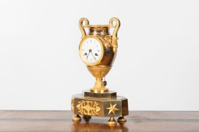 Gilt bronze cassolette clock, resting on...