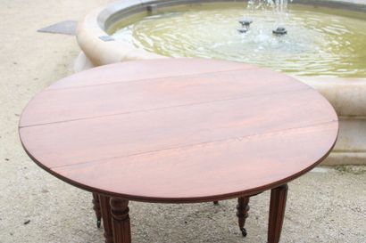 Round wooden table with shutters, resting...