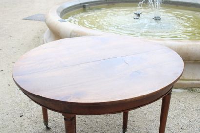 Round walnut table with extension system,...