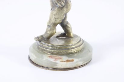 Water-carrying putto in chased and gilded...