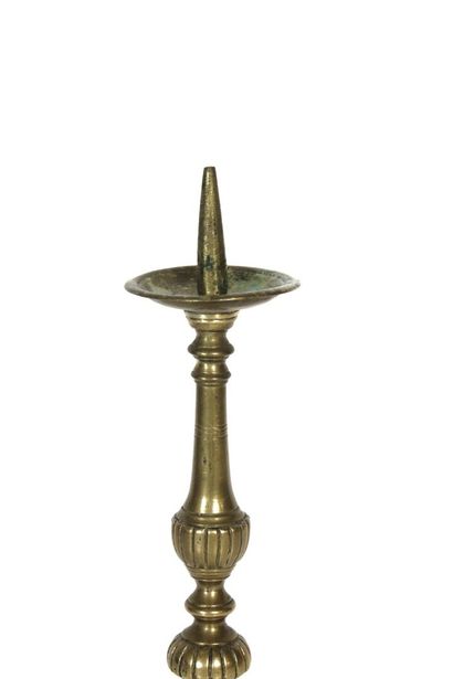 Gilt bronze candle pick with carved decoration....