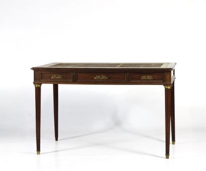 Flat mahogany desk opening with three drawers...