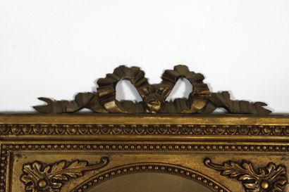 Carved and gilded molded wood trumeau mirror...