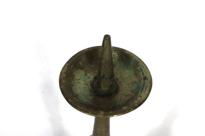 Gilt bronze candle pick with carved decoration....