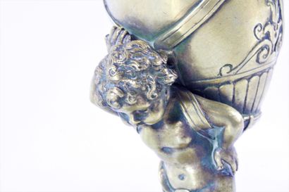 Water-carrying putto in chased and gilded...