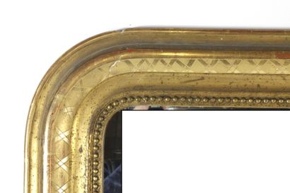 Gilded and carved wood mirror with pearl...