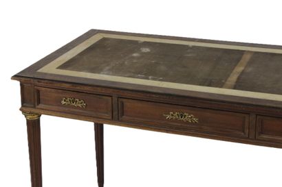 Flat mahogany desk opening with three drawers...