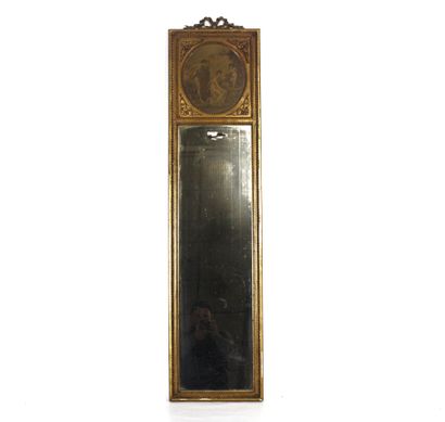 Carved and gilded molded wood trumeau mirror...