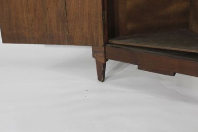 Oak corner cabinet opening with a front door....