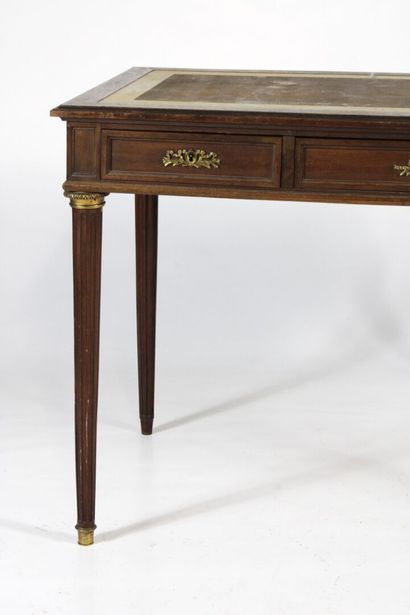 Flat mahogany desk opening with three drawers...