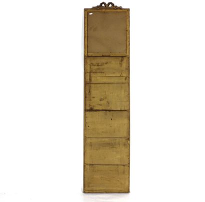Carved and gilded molded wood trumeau mirror...