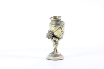 Water-carrying putto in chased and gilded...