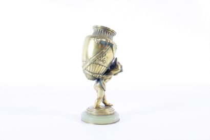 Water-carrying putto in chased and gilded...