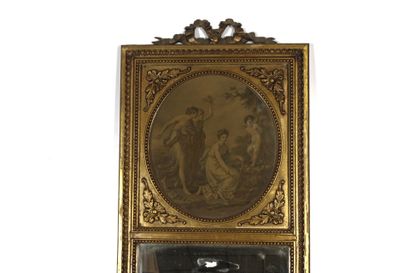 Carved and gilded molded wood trumeau mirror...