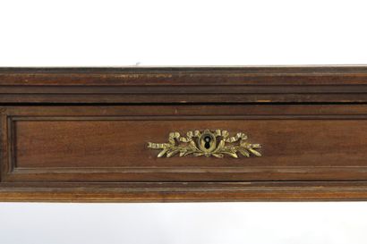 Flat mahogany desk opening with three drawers...