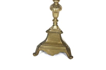 Gilt bronze candle pick with carved decoration....