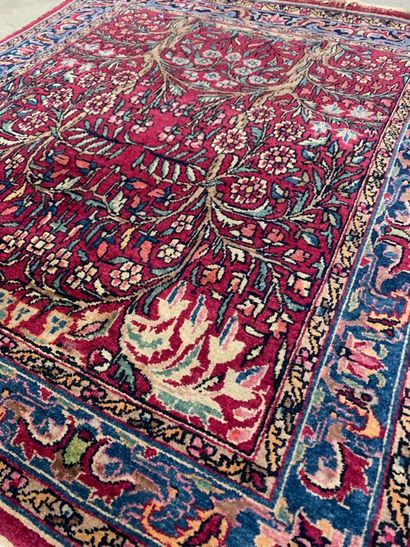 Kirman carpet,
Garnet field with original...