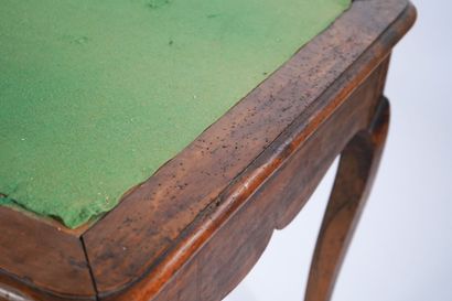 Large flat desk in natural wood opening to...