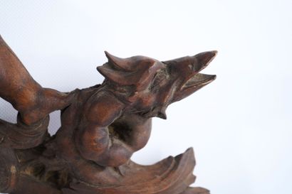 Molded, openwork and carved walnut pediment...