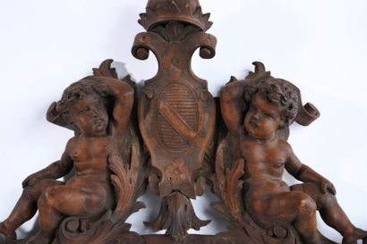 Molded, openwork and carved walnut pediment...