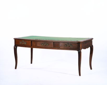 Large flat desk in natural wood opening to...