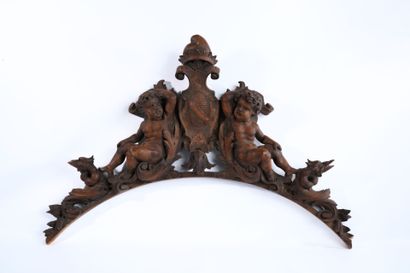 Molded, openwork and carved walnut pediment...