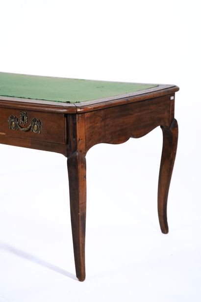 Large flat desk in natural wood opening to...