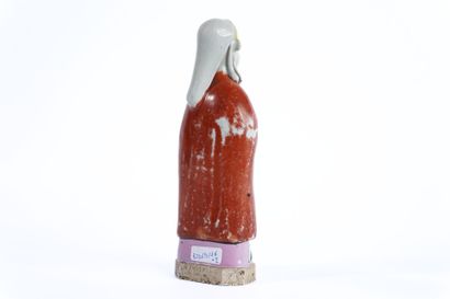 CHINA. 
Pair of polychrome porcelain statuettes....