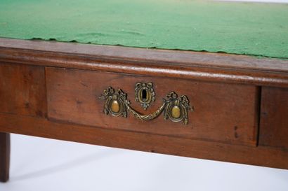 Large flat desk in natural wood opening to...