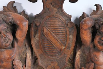 Molded, openwork and carved walnut pediment...