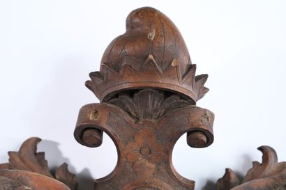 Molded, openwork and carved walnut pediment...