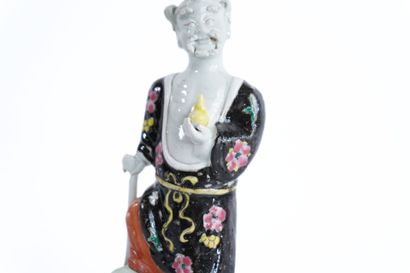 CHINA. 
Pair of polychrome porcelain statuettes....