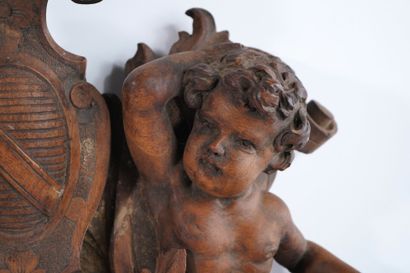 Molded, openwork and carved walnut pediment...
