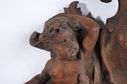 Molded, openwork and carved walnut pediment...