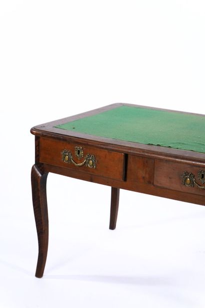 Large flat desk in natural wood opening to...