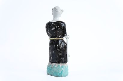CHINA. 
Pair of polychrome porcelain statuettes....