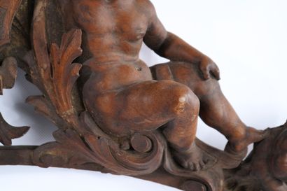 Molded, openwork and carved walnut pediment...