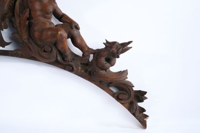 Molded, openwork and carved walnut pediment...