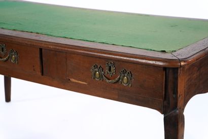Large flat desk in natural wood opening to...