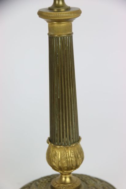 Pair of gilt brass candlesticks. Fluted and...