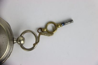Pocket watch in metal with its key. Dial...