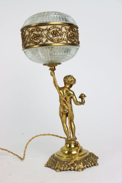 Pair of gilt bronze lamps, the shaft formed...