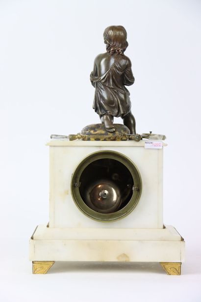 Marble clock surmounted by a sculpture of...