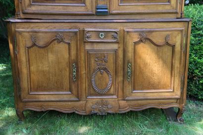 Buffet in molded and carved oak opening by...