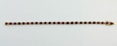 Bracelet en or jaune 18K (750/1000) orné...
