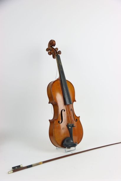 Study violin in its case. A bow is attached...