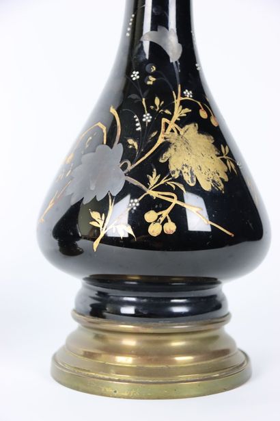 A pair of baluster oil lamps in porcelain...