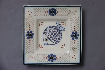 Four small plates of which one representing...