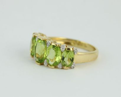 Bague jarretière en or jaune 18K (750/1000)...