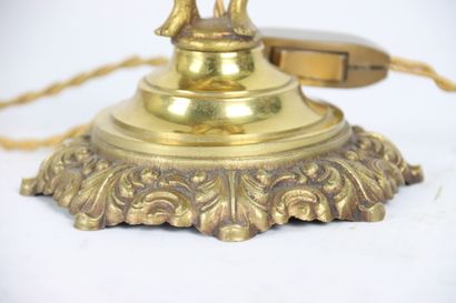 Pair of gilt bronze lamps, the shaft formed...